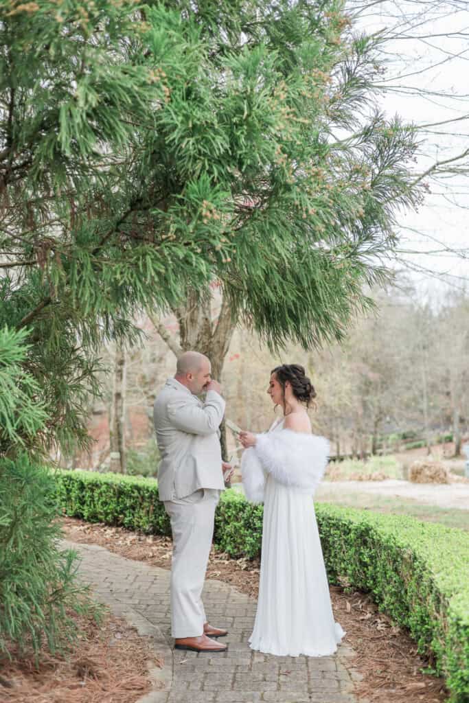 Sarah + Jake Wedding Couple hugging on the garden path