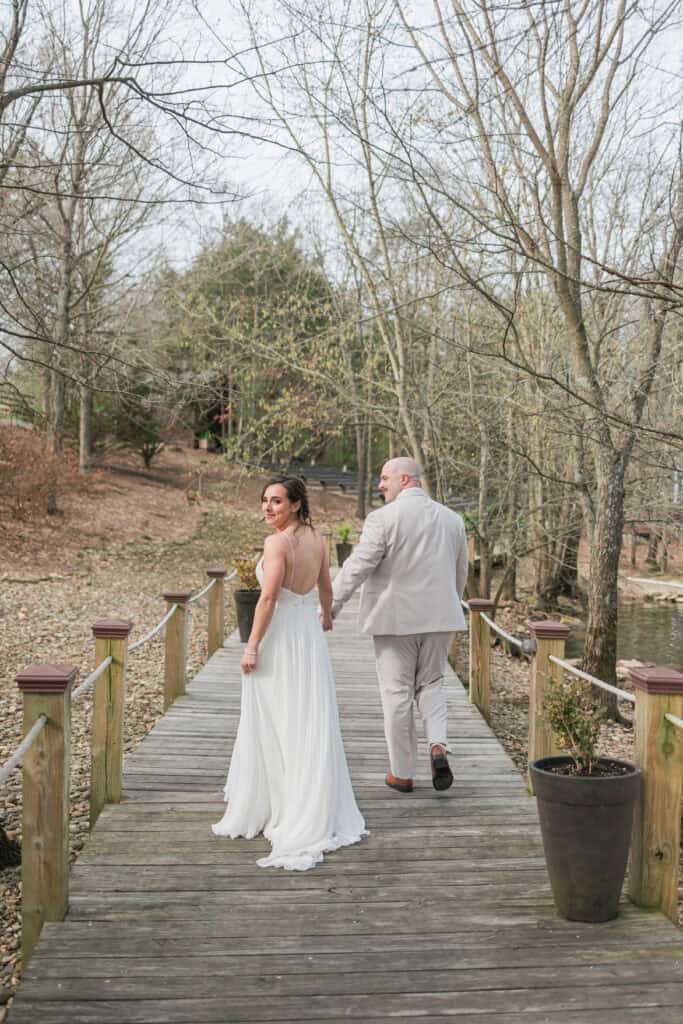 Sarah + Jake Wedding Couple walking down the dock together