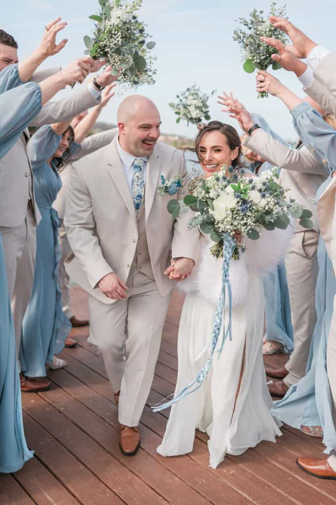 Sarah + Jake Wedding Wedding party cheering for the newlyweds