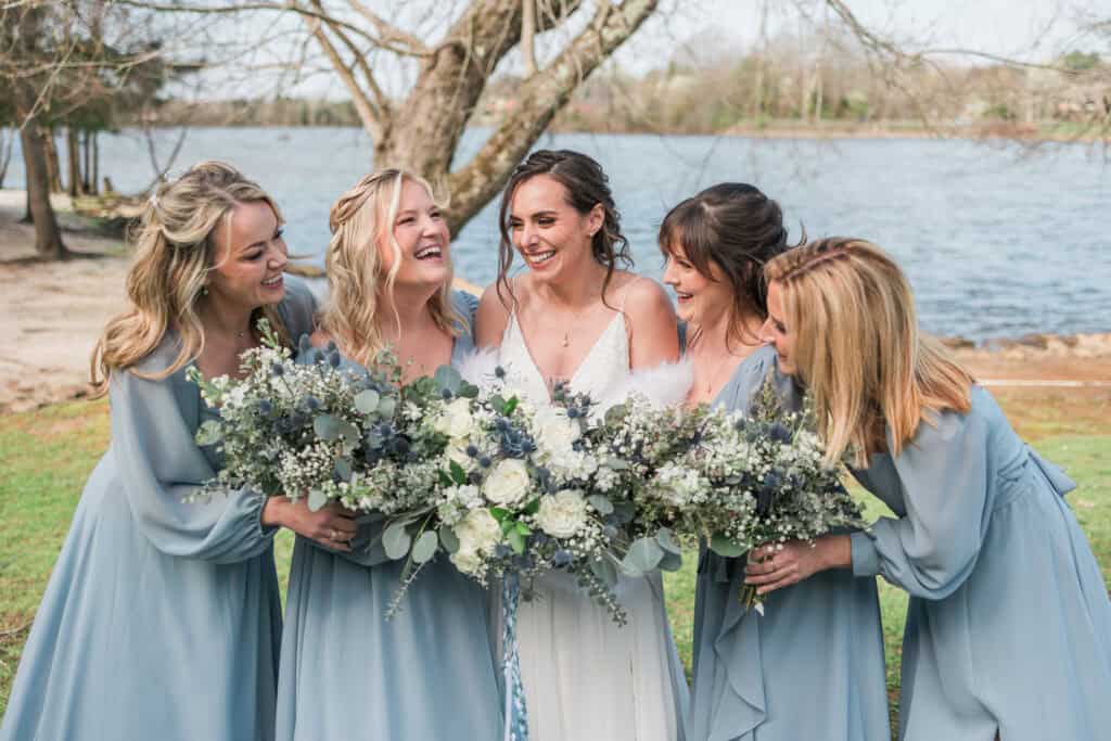 Sarah + Jake Wedding Bridesmaids holding white and blue bouquets