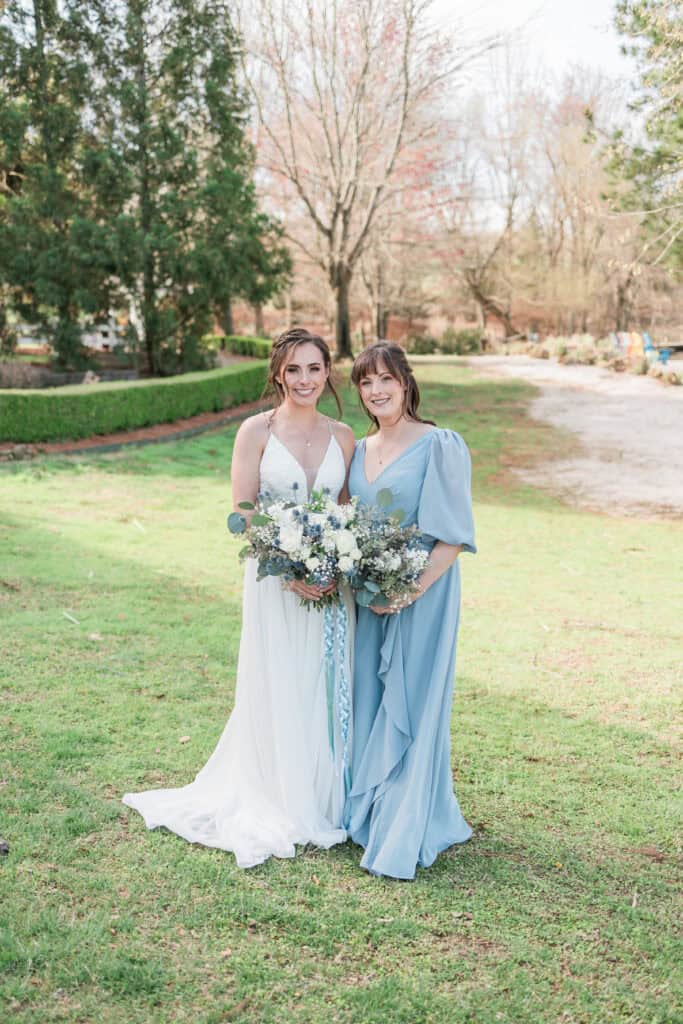 Sarah + Jake Wedding Bride with her maid of honor on the lawn