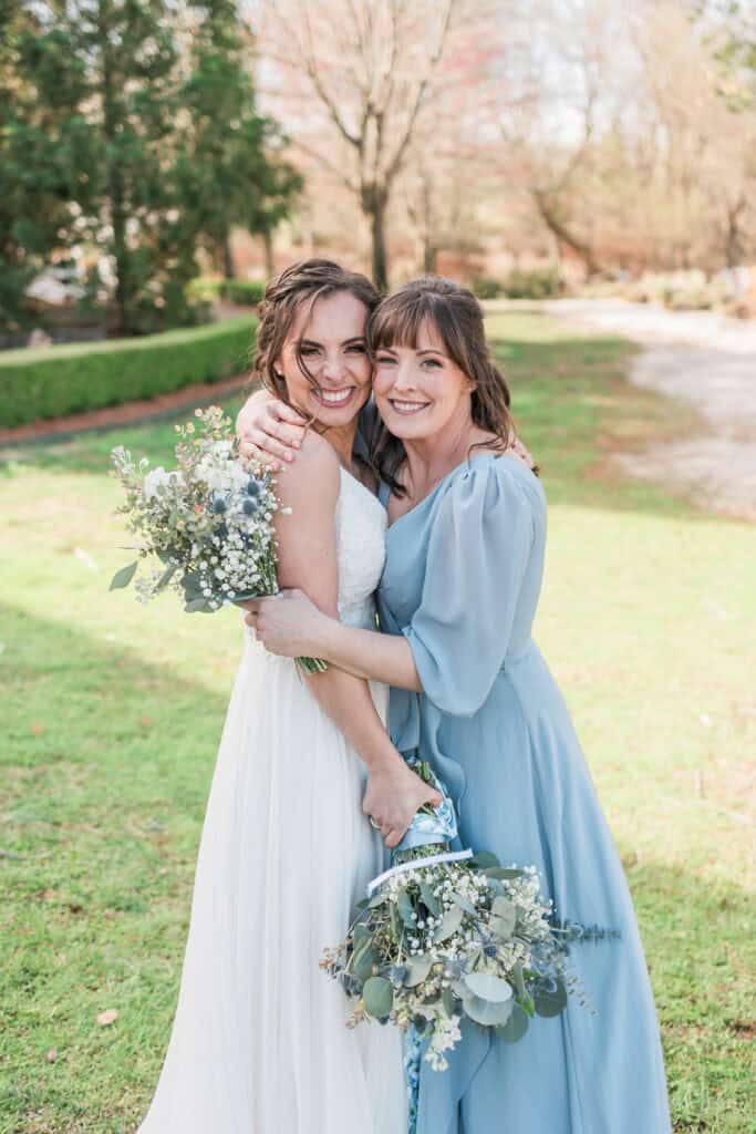 Sarah + Jake Wedding Bride and bridesmaid smiling together