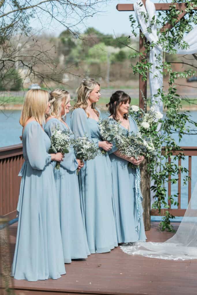 Sarah + Jake Wedding Bridesmaids in dusty blue during the ceremony